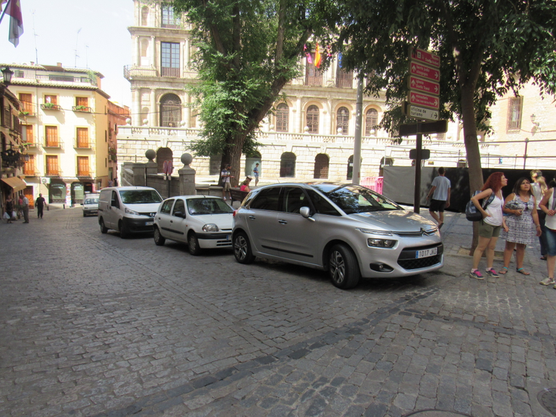 A Citroen C4 Picasso, what I believe is a Renault (update: Renault Clio, thanks Cé Hé Sin), and a Nissan NV200 Cargo.